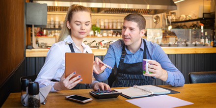 Man and Woman going through their restaurant finances