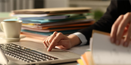 Close up of executive hands on a computer